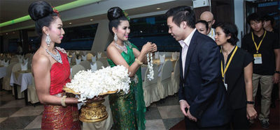 Attendees receive jasmine leis