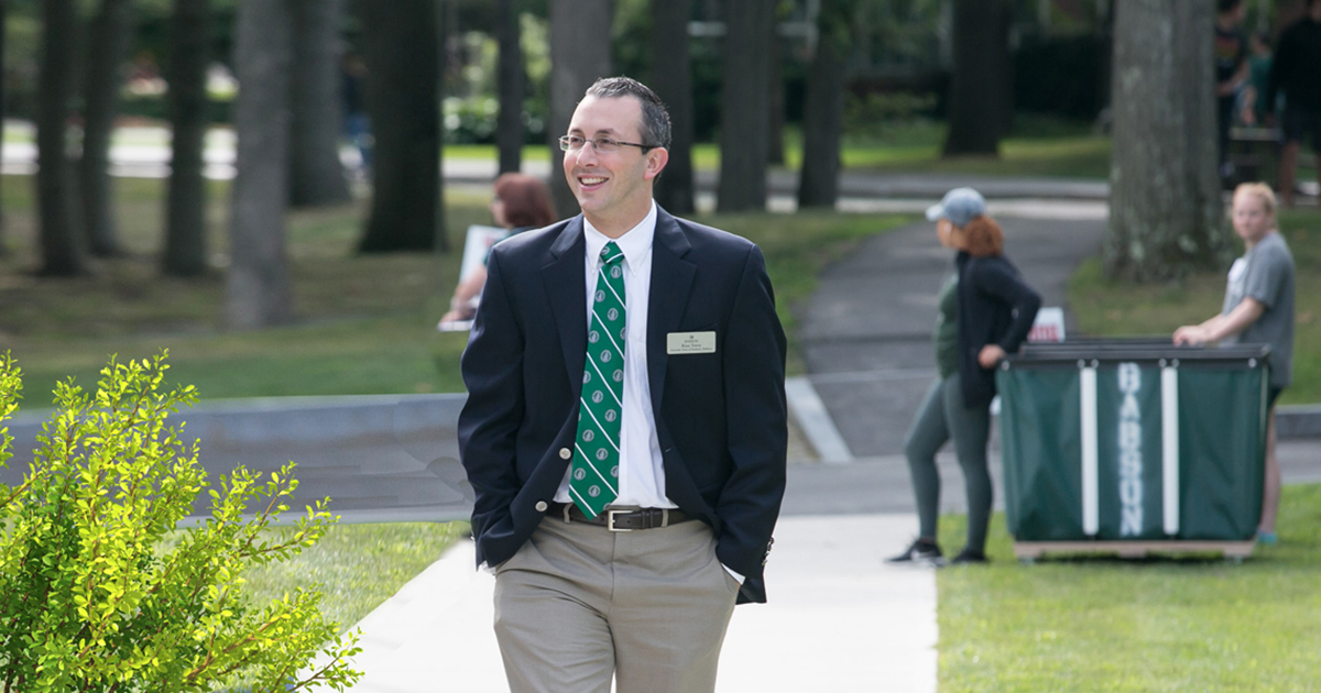 Ryan Travia walks across campus in 2017