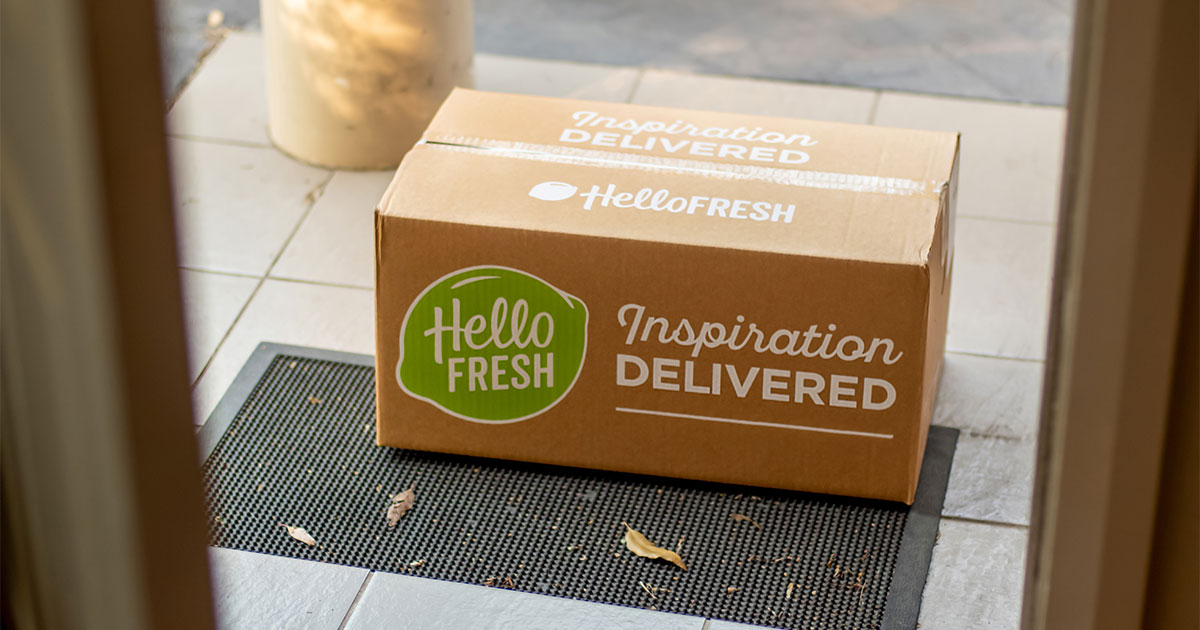 A box containing a meal kit that is waiting on a doorstep