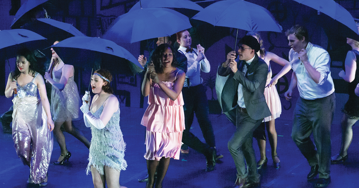 Babson Players perform on stage in Singing in the Rain