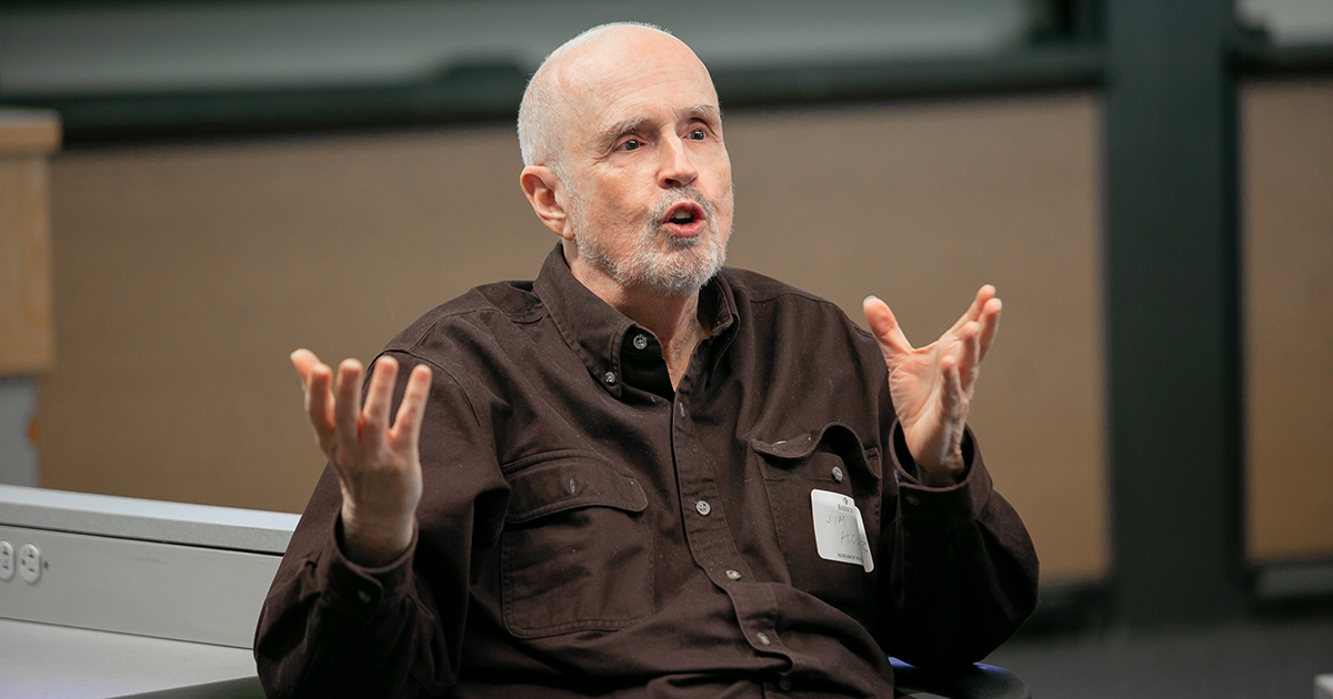James Hoopes gestures while speaking at Faculty Research Day in 2019