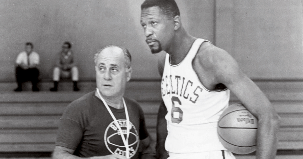 Black-and-white archive photo of Red Auerback and Bill Russell practicing at Babson
