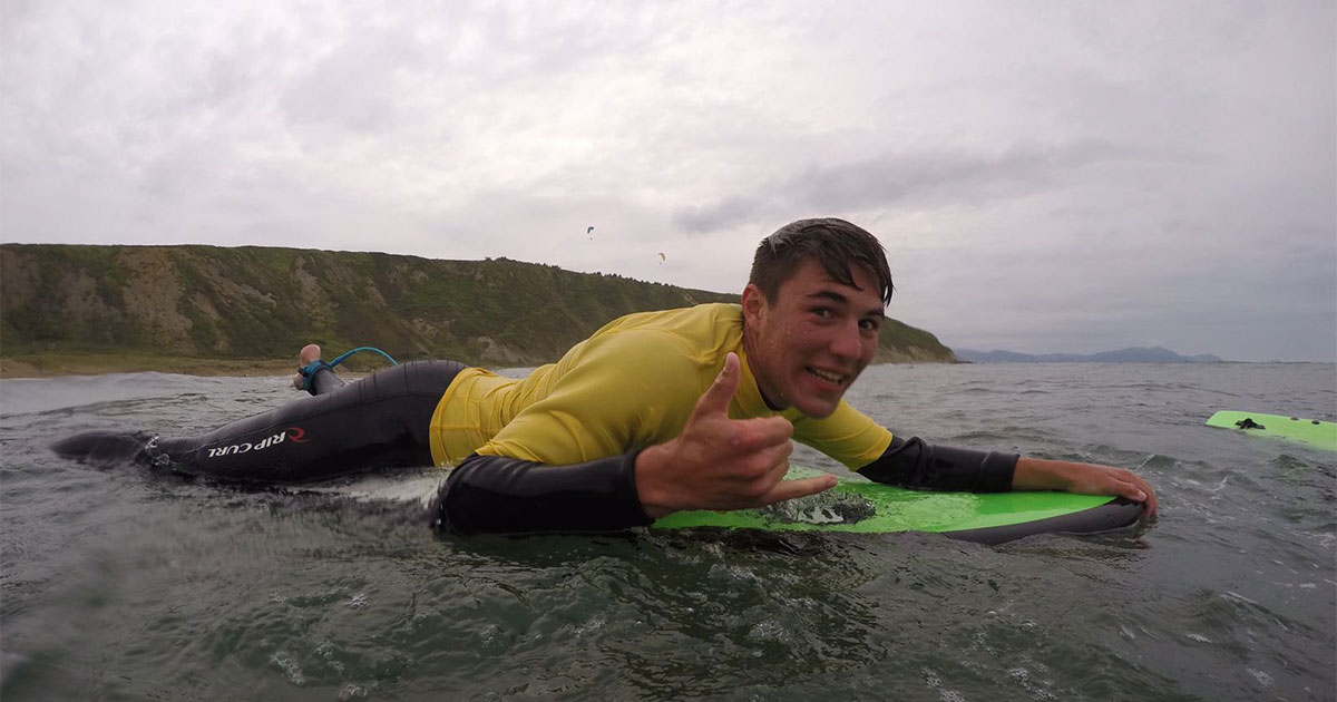 Benjamin Cantera ’22 rides a surfboard