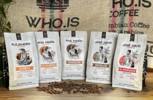 A line of Who Is Coffee bags depicting the names and faces of farmers