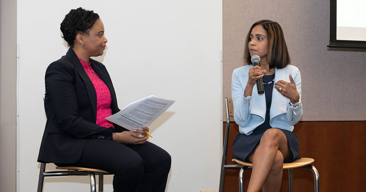 Wiljeana Jackson Glover and Deepthi Bathina sit on chairs and discuss health technology
