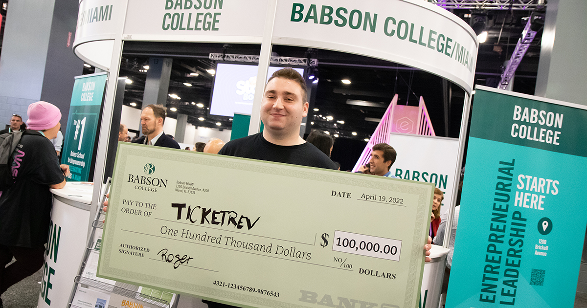 Jason Shatsky poses with the grand-prize $100,000 check