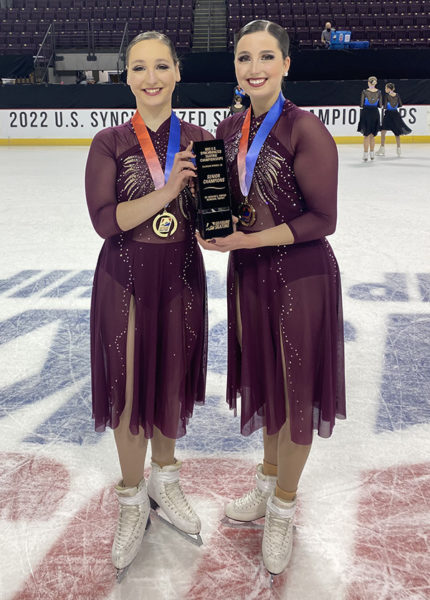 Laura Nicula and Elissa Kempisty pose together on the ice