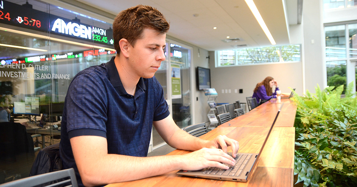 Boris Chertok works on a computer on campus