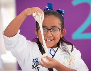 A girl conducts a science experiment