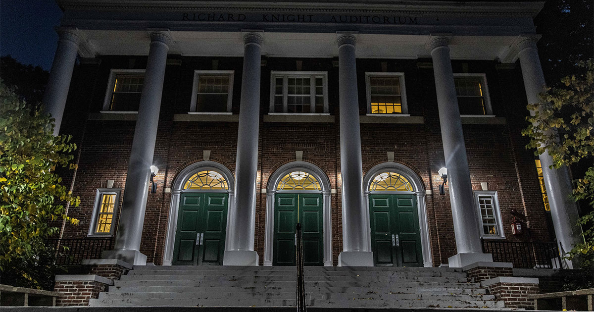 A nighttime picture of Babson's Knight Auditorium