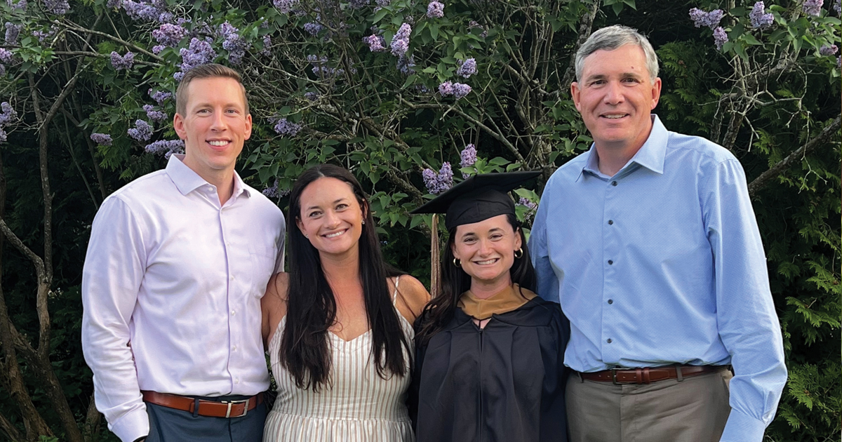 Catherine Crosby poses for a graduation photo with her family
