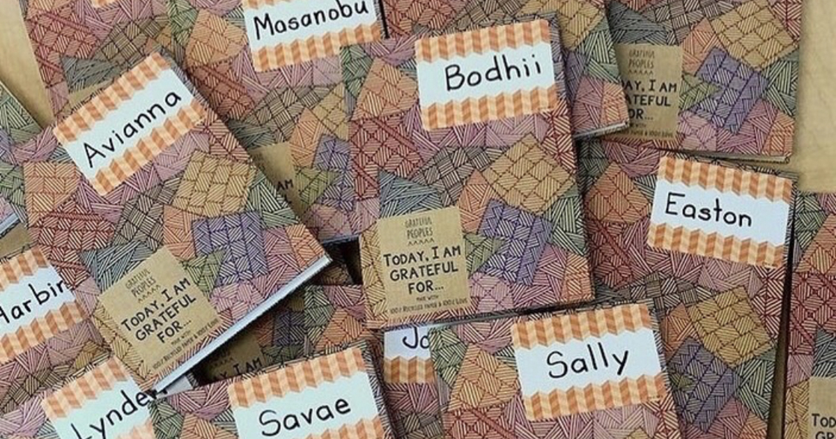 Closeup of gratitude journals with children's names