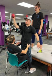 Jake Thibeault does exercises at physical therapy
