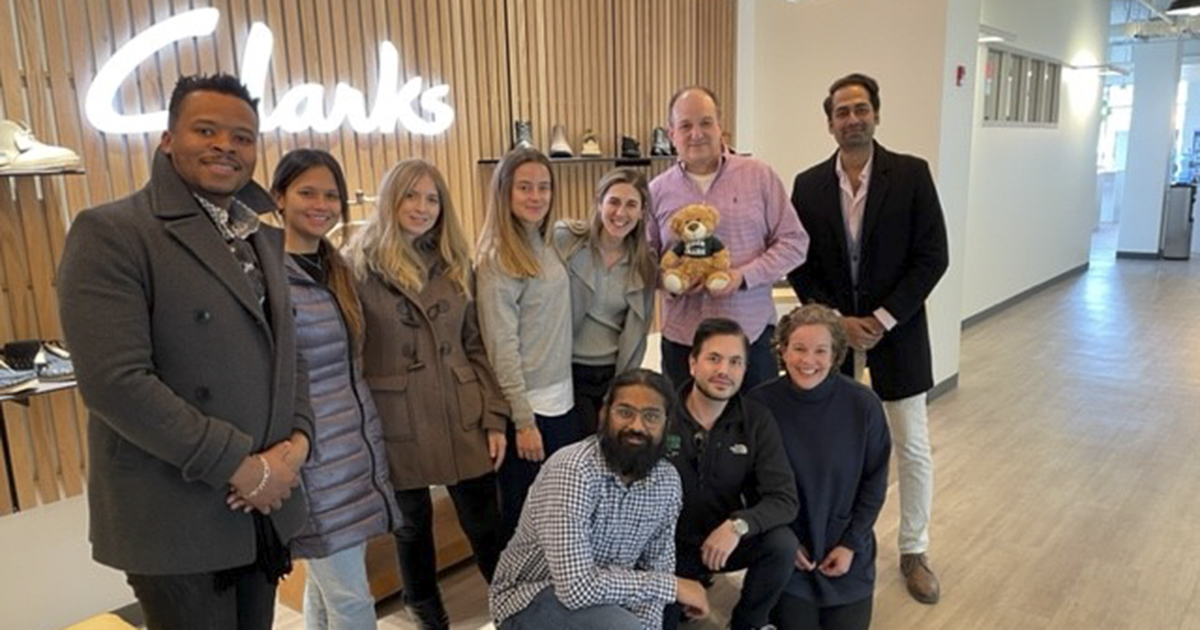 Group of students pose for a photo at Clarks headquarters in Needham, Massachusetts.