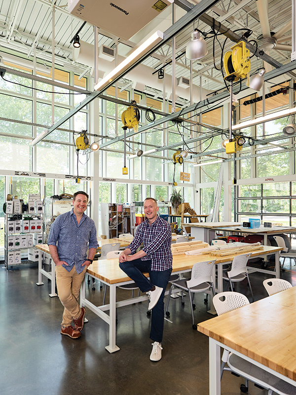 Joshua Herzig-Marx and Rich Palmer pose for a photo inside the Weissman Foundry