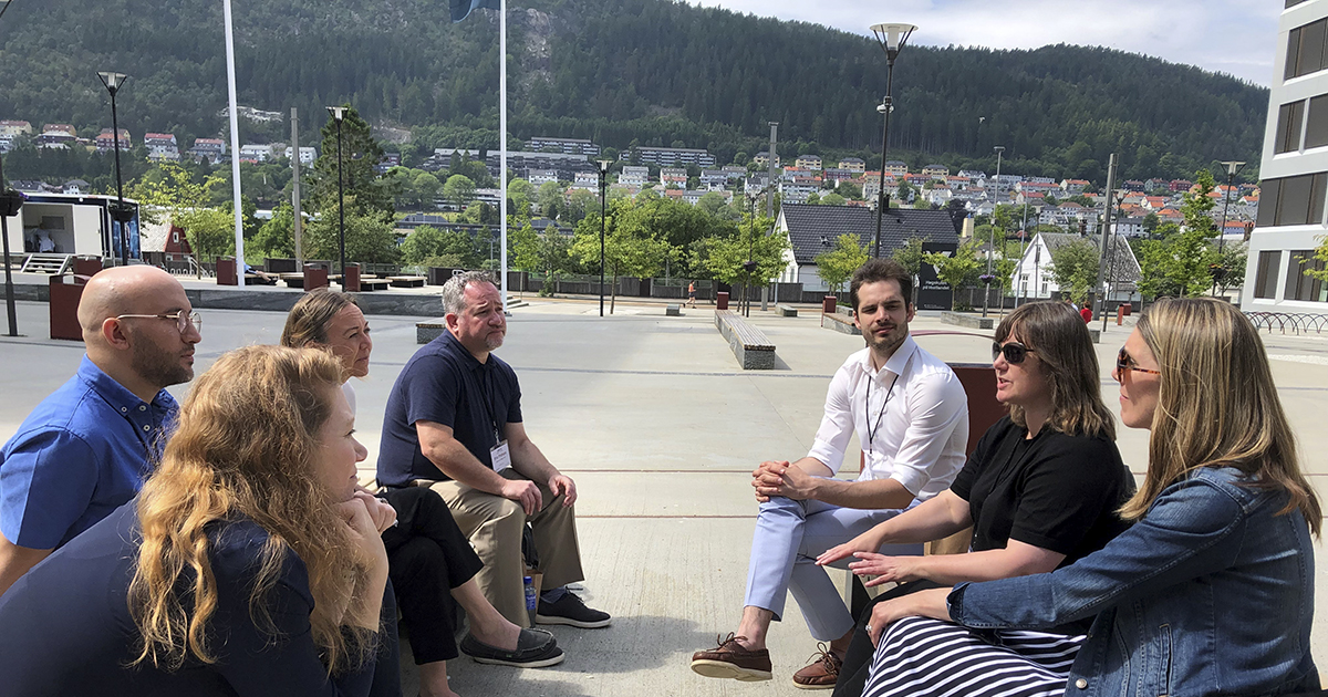 Faculty from Norway and the United States meet outside in Bergen, Norway.