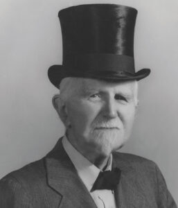 Roger Babson in top hat