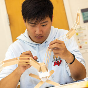 A student works on his sculpture