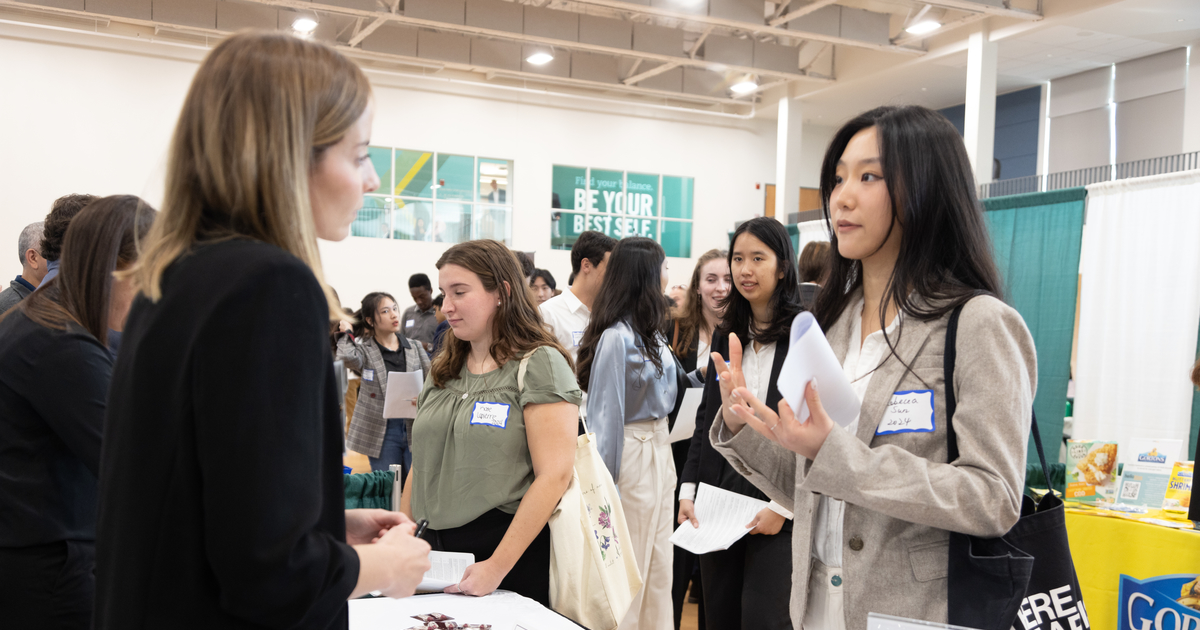 Students navigate networking opportunities at a Babson College career fair in 2022.