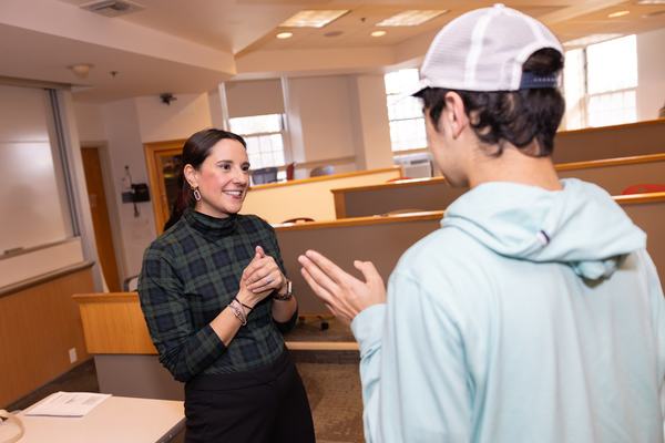 Assistant Professor of Practice Michele Kerrigan speaks with students after class. (Photo by Nic Czarnecki/Babson College)