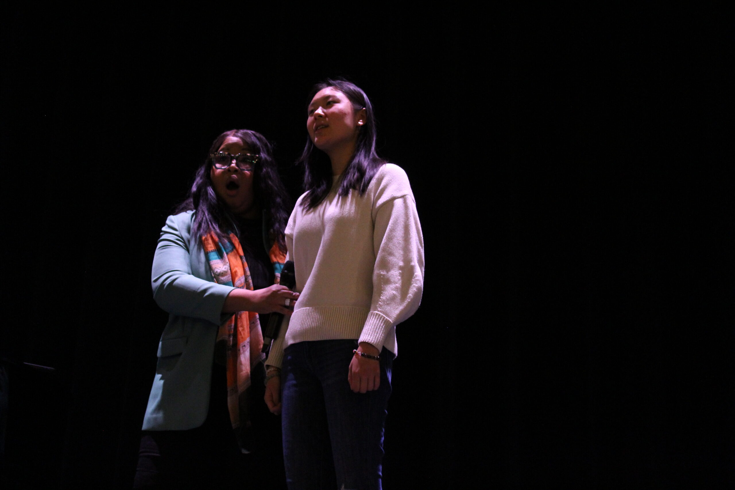 A student receives coaching from opera soprano Karen Slack.