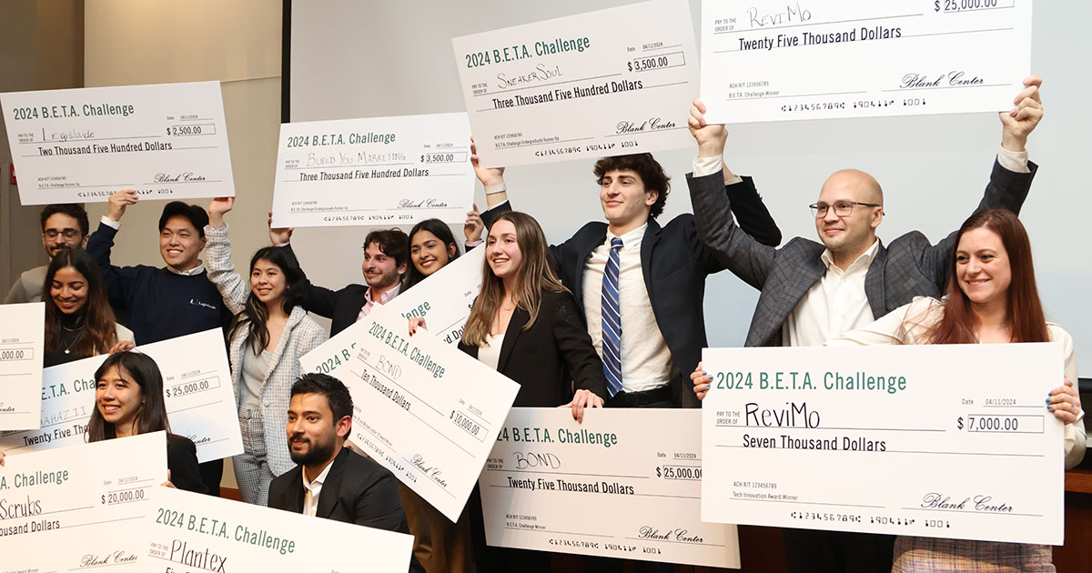 The winners of the 2024 B.E.T.A. Challenge holding their winning checks.