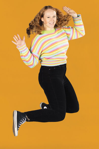 Madison Grogan leaps in the air for a fun portrait