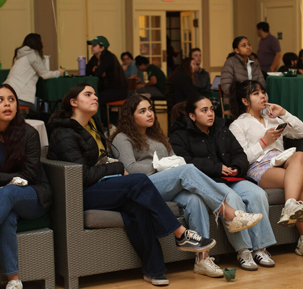 Babson students kept an eye on the competition at the B.E.T.A. Challenge watch party, held for the first time in the Knight Auditorium this year. 