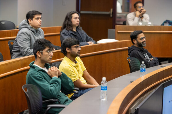 Babson students sit and listen to a tech talk.