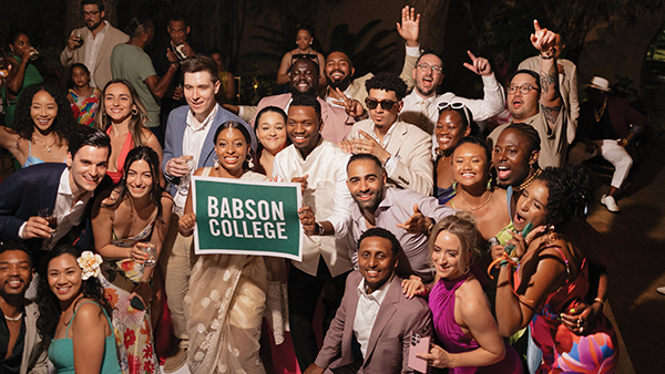 A group of alumni pose for a photo