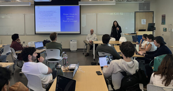 Andrea Ashford-Hicks speaks in front of the class