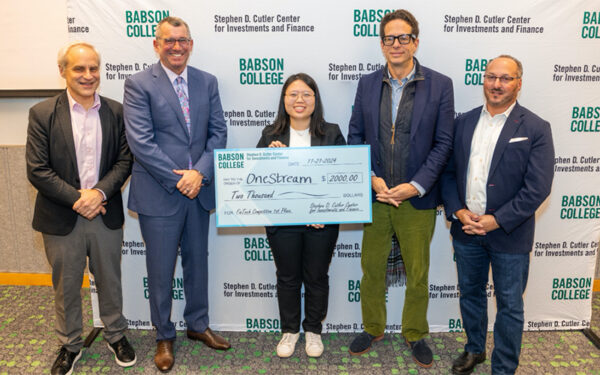 Kunru Li holds the winning check while posing for a photo with four others