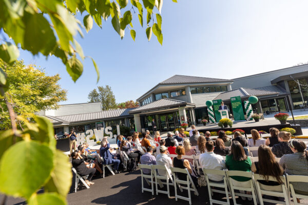 People congregate outside at the dedication ceremony of the Herring Family Entrepreneurial Leadership Village