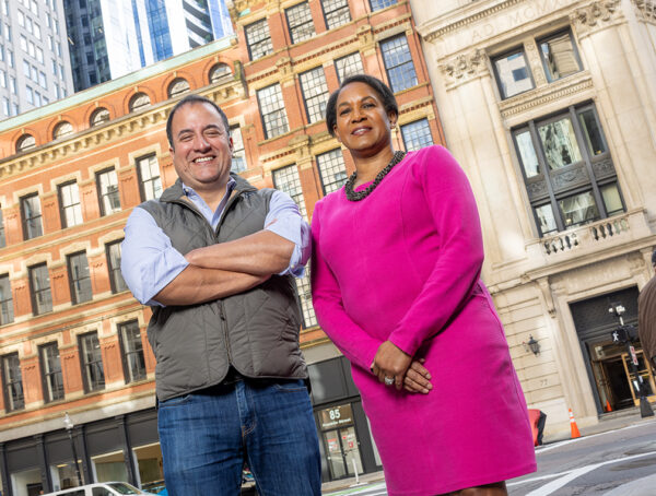 Moris Castillo and Allison Picott pose together for a portrait outdoors