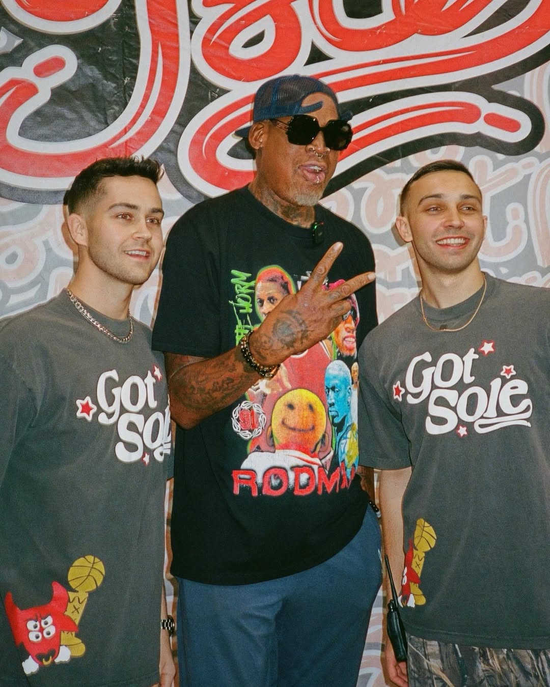 Got Sole co-founders Jonathan DiModica ’21 (right) and brother, Joseph (left), stand with Denis Rodman (center) at one of Got Sole's sneaker conventions.