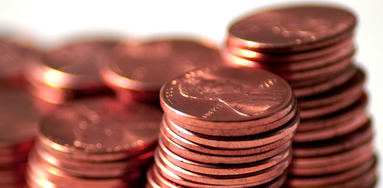 A close up photo of stacked pennies, which the U.S. government might stop making.