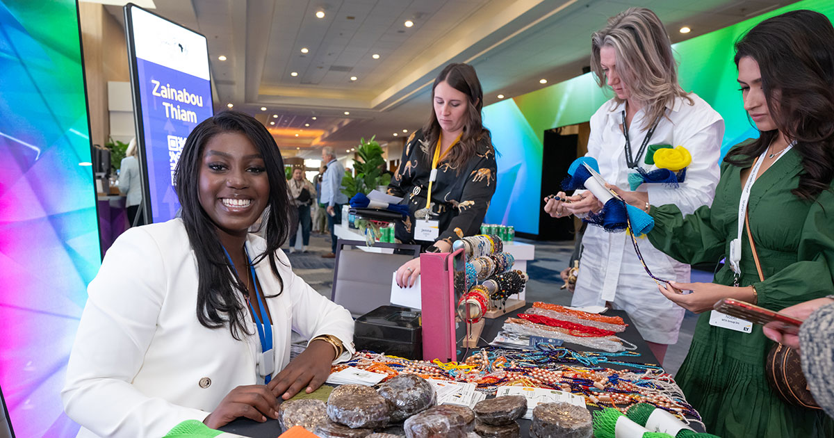 Zainabou Thiam ’28 sits at a table selling products to waiting customers