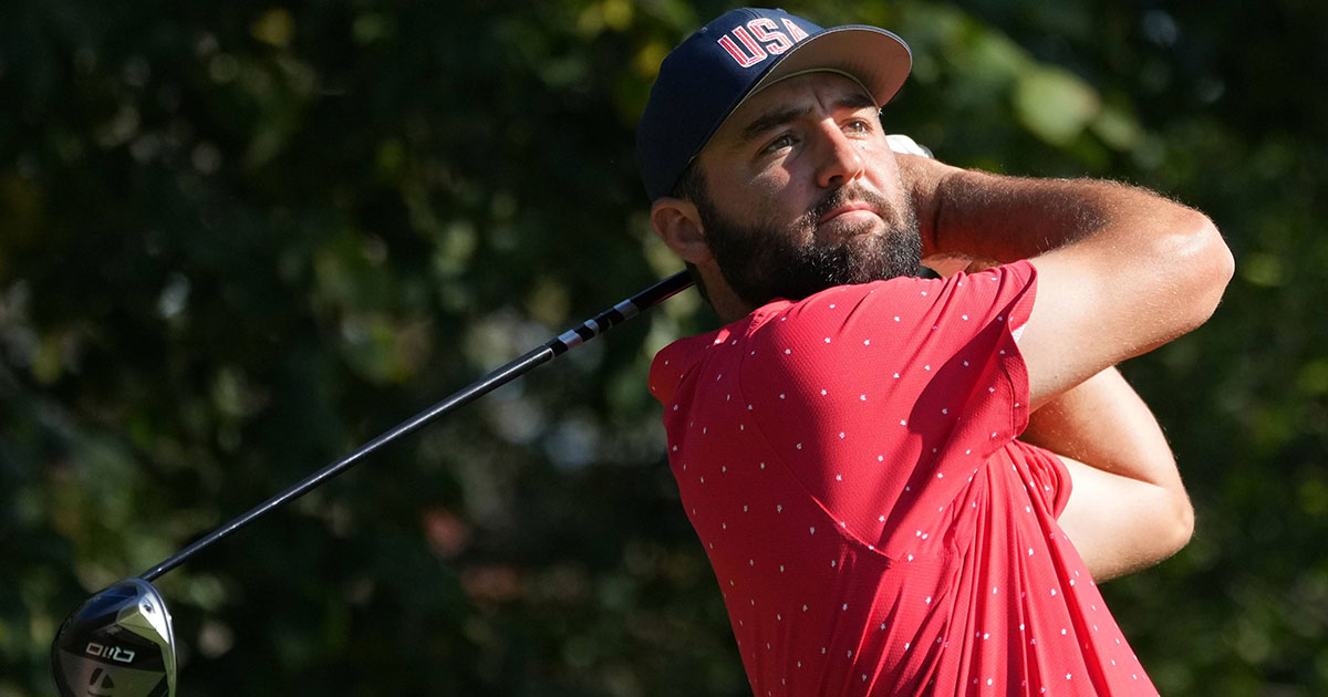 Scottie Scheffler swings a golf club