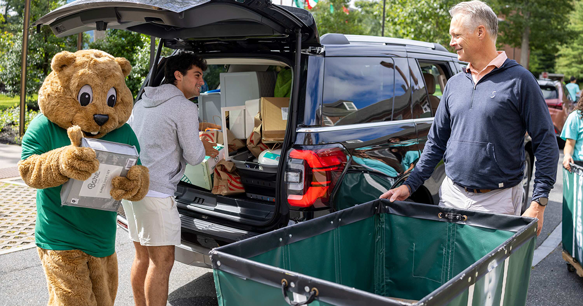 College mascot and family move in a new student to college.