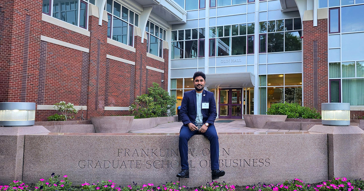 Babson student outside graduate building.