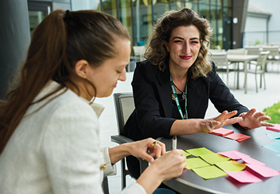 Participants talk while working on a project in a LEAP session