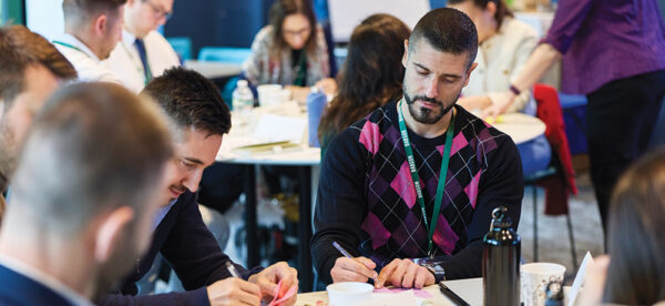 Professionals from Bulgaria work at a table during the Leadership Education in America Program