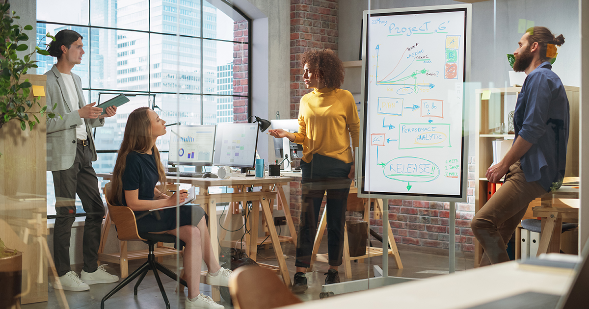 A businesswoman leads a team vibrant and engaging team discussion in a modern office setting
