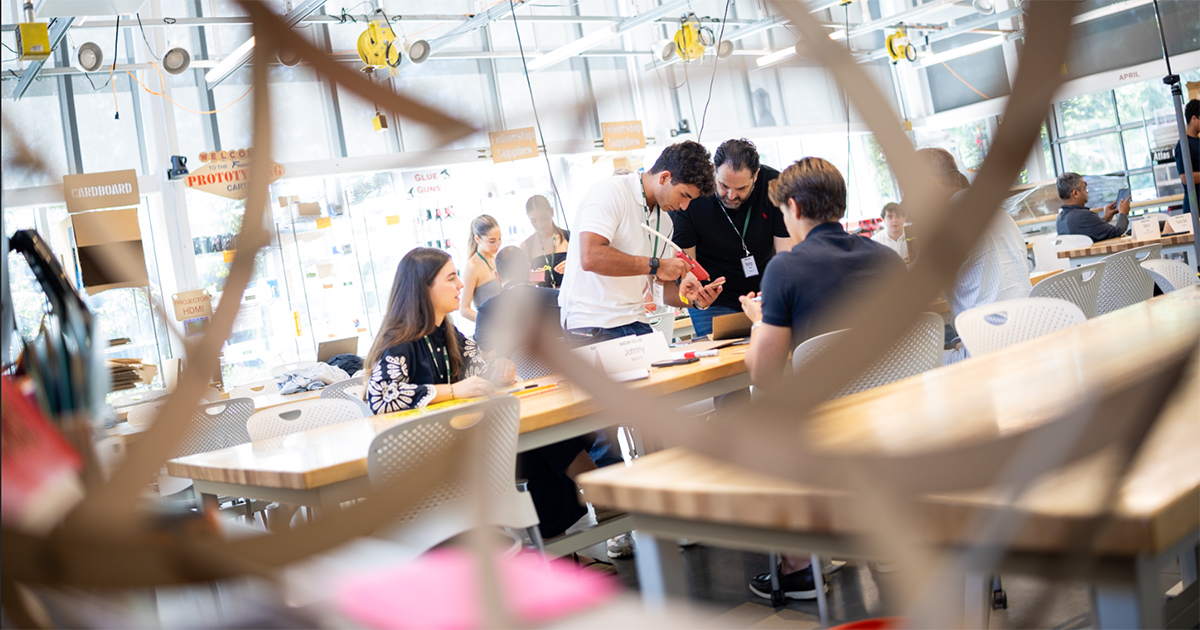 A group is seen working a project from a distance