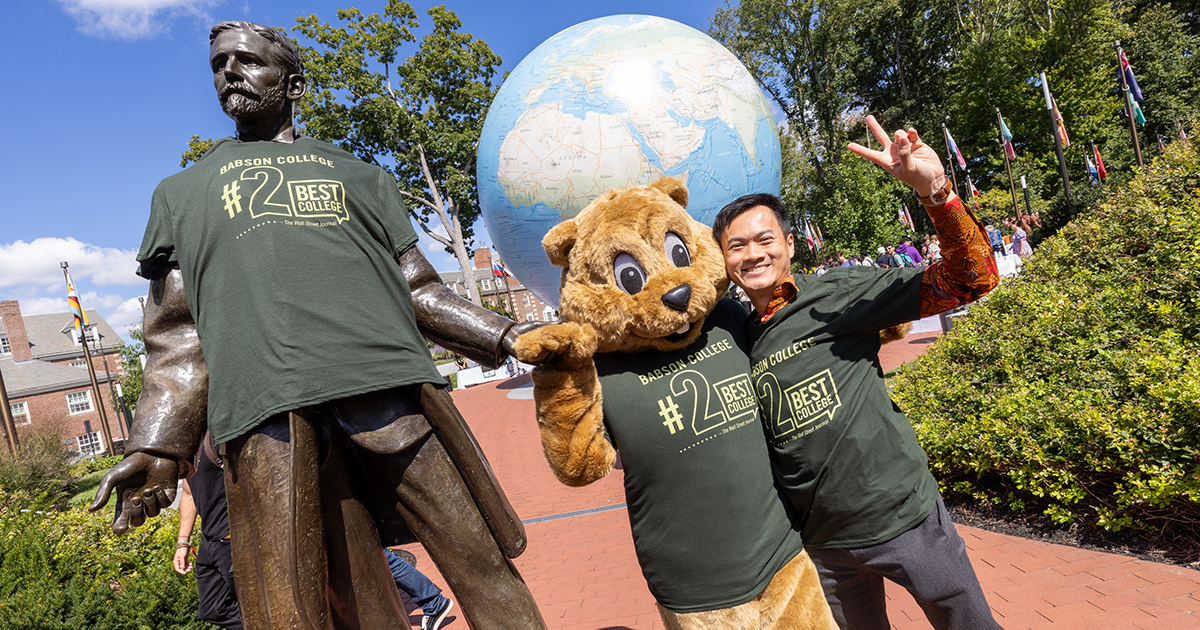 The Babson community and mascot celebrate at the Roger Babson statue last year