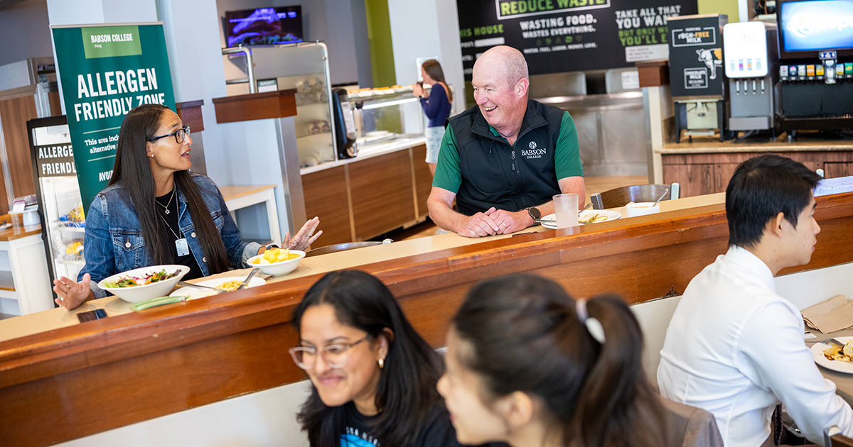 Farrah Narkiewicz and Rob Major sit and talk at Trim Dining Hall
