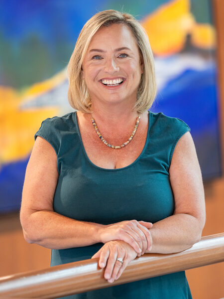 Kelly Lynch smiles while posing for a portrait