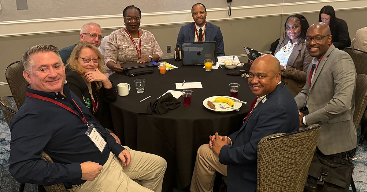 Babson Professor Jeffrey Shay ’87, MBA’91, sits at a table with professors from Historically Black Colleges and Universities