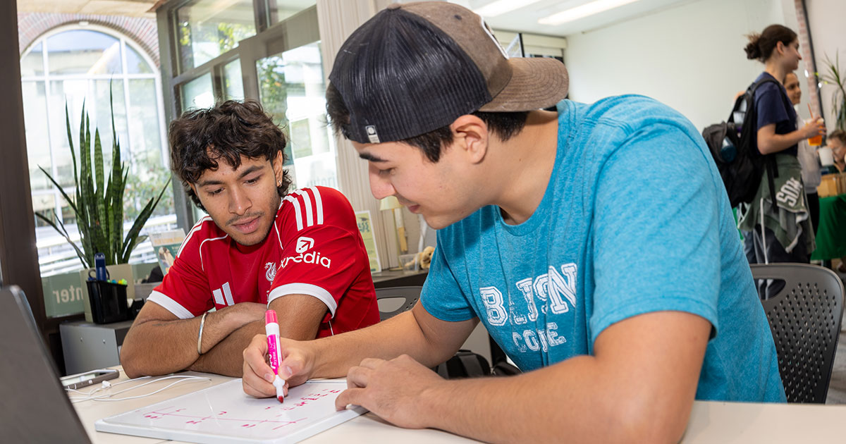 Riyan Palanpur ’27 (left) and Tyler Okun ’27 study together