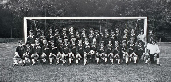 A black-and-white team photo of the 1975 men's soccer team